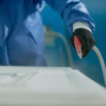 closeup-worker-spraying-timber-with-spray-gun-woodworking-factory_637285-12067